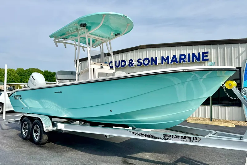 The Image of 2026 Carolina Skiff 24 Ultra Elite boat on trailer at marine dealership. - 1