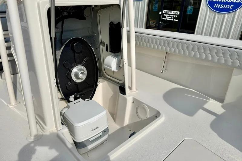 Slide: The Image of 2026 Carolina Skiff 24 Ultra Elite boat interior with storage and seating features. - 21