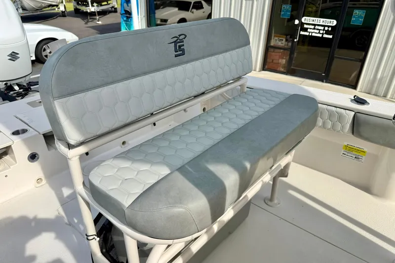 Slide: The Image of 2026 Carolina Skiff 24 Ultra Elite boat seat with gray upholstery and hexagonal pattern. - 24