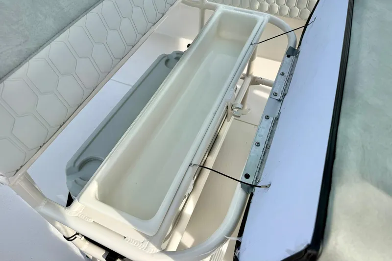 Slide: The Image of 2026 Carolina Skiff 24 Ultra Elite boat interior storage compartment detail. - 25