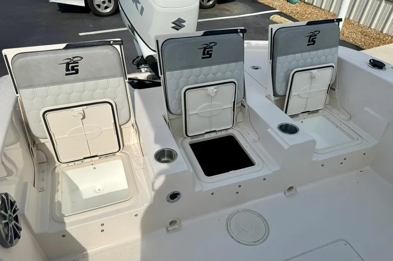 Slide: The Image of 2026 Carolina Skiff 24 Ultra Elite boat seating and storage compartments. - 36