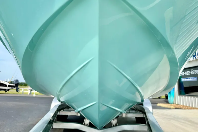Slide: The Image of Close-up of 2026 Carolina Skiff 24 Ultra Elite boat hull on trailer. - 9