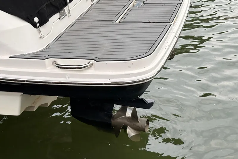 Slide: The Image of Rear view of 2021 Sea Ray SDX 250 boat with propeller in water. - 10