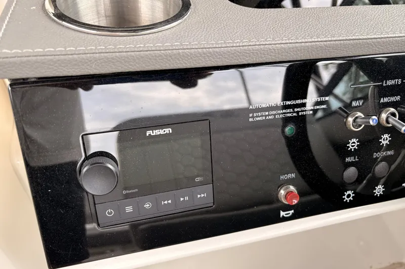 Slide: The Image of Control panel of a 2021 Sea Ray SDX 250 boat with Fusion audio system. - 12