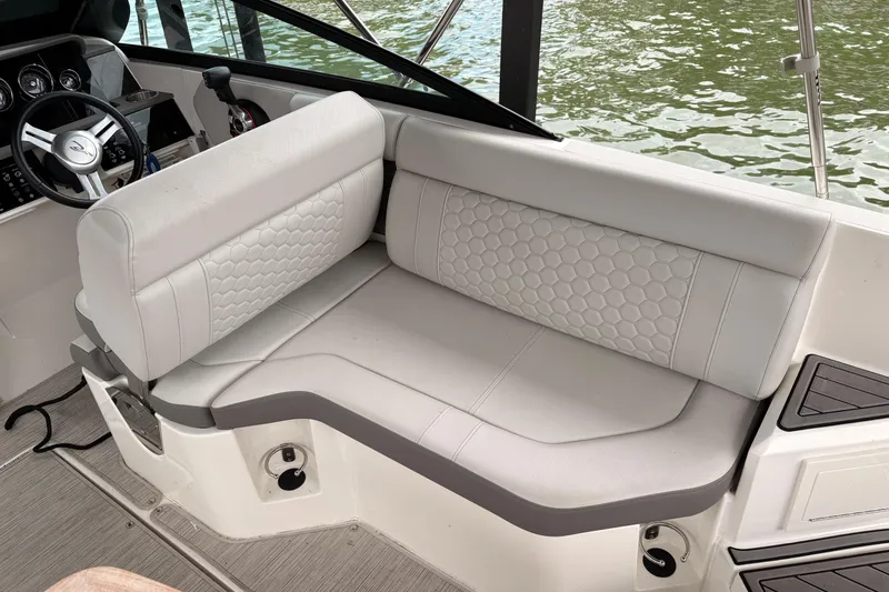 Slide: The Image of Luxurious seating on 2021 Sea Ray SDX 250 boat, featuring elegant upholstery and modern design. - 17