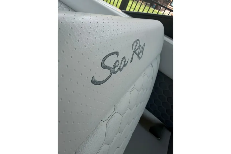Slide: The Image of White leather seat with "Sea Ray" logo on 2021 SDX 250 boat. - 23