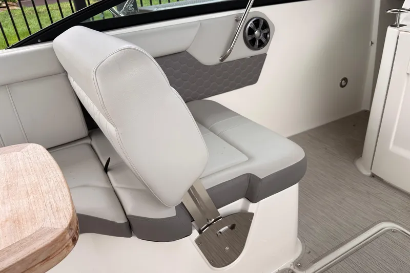 Slide: The Image of Interior seating of 2021 Sea Ray SDX 250 boat with gray and white upholstery. - 18