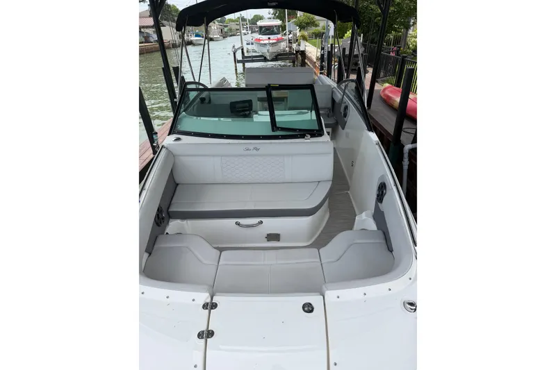 Slide: The Image of 2021 Sea Ray SDX 250 boat interior with spacious seating and sleek design. - 27