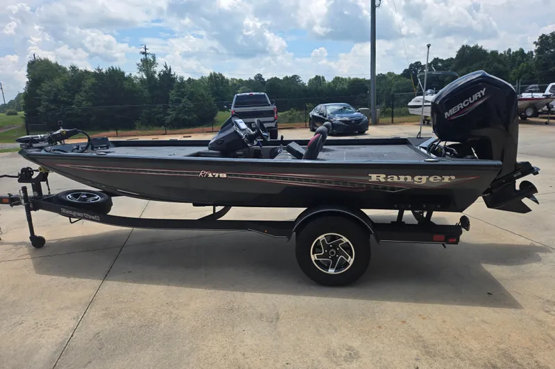 The Image of 2023 Ranger RT178 boat with Mercury engine on trailer, parked outdoors. - 1
