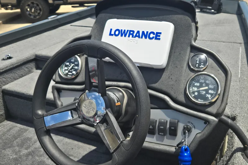 Slide: The Image of 2023 Ranger RT178 boat dashboard with steering wheel and Lowrance display. - 12