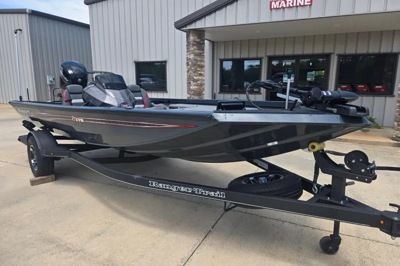 Slide: The Image of 2023 Ranger RT178 boat on trailer outside marine shop. - 4