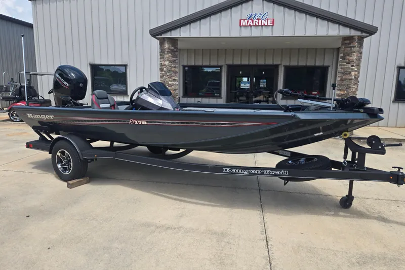 Slide: The Image of 2023 Ranger RT178 boat on trailer outside marine dealership. - 5