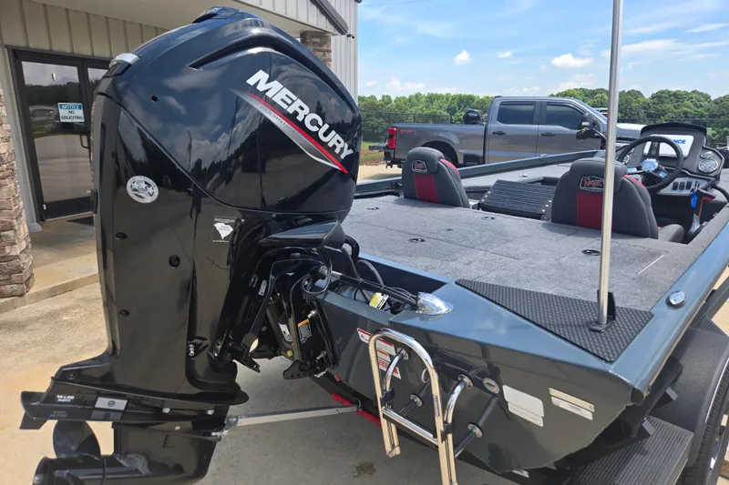 Slide: The Image of 2023 Ranger RT178 boat with Mercury outboard motor, parked outdoors. - 7