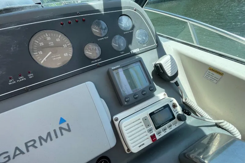 Slide: The Image of Dashboard of a 1997 Tiara Yachts 3100 Open with Garmin navigation equipment. - 11