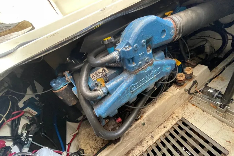 Slide: The Image of Engine compartment of a 1997 Tiara Yachts 3100 Open, featuring Crusader engine components. - 27