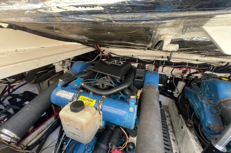 Slide: The Image of Engine compartment of a 1997 Tiara Yachts 3100 Open, showcasing mechanical components. - 33