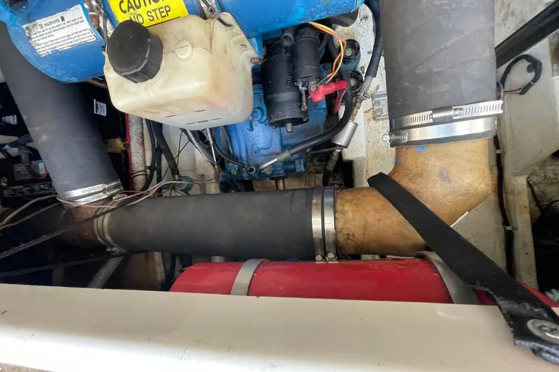 Slide: The Image of Engine compartment of a 1997 Tiara Yachts 3100 Open, showing hoses and components. - 37