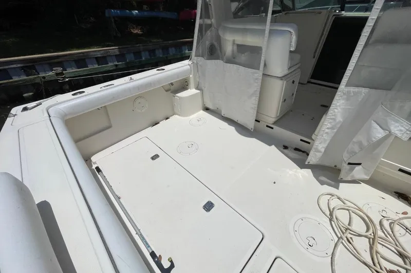 Slide: The Image of 1997 Tiara Yachts 3100 Open boat deck with seating and storage compartments. - 5