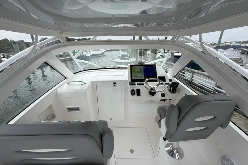 Slide: The Image of Interior view of 2024 Albemarle 30 Express boat cockpit with modern controls and seating. - 42