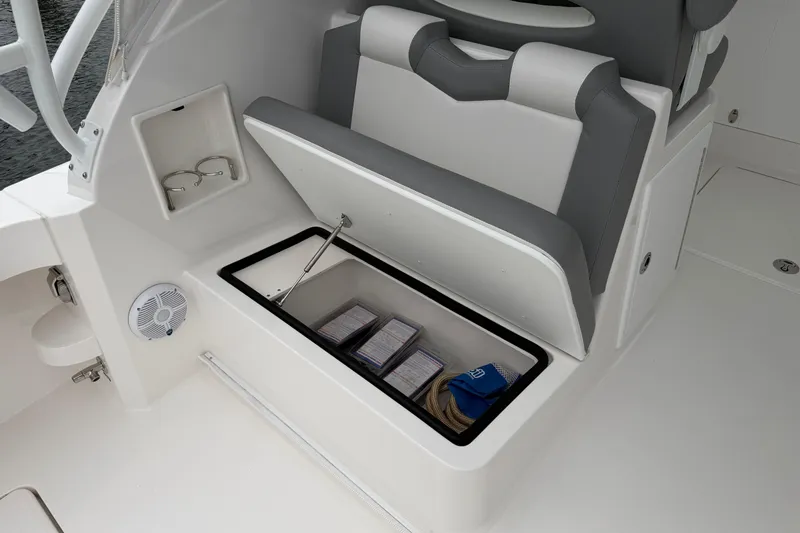 Slide: The Image of 2024 Albemarle 30 Express boat interior storage compartment with seating and accessories. - 27