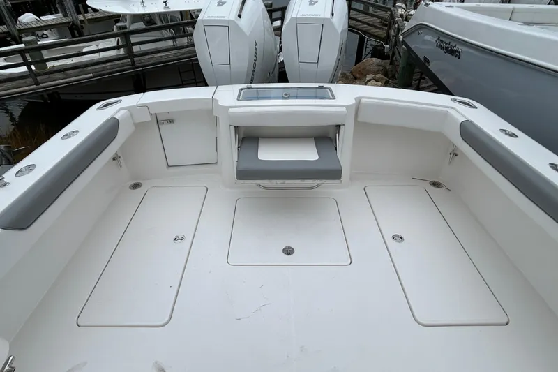 Slide: The Image of 2024 Albemarle 30 Express boat deck with seating and storage compartments. - 30