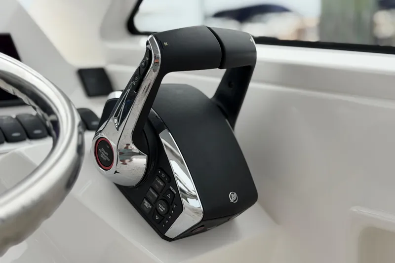 Slide: The Image of Close-up of 2024 Albemarle 30 Express boat throttle control in cockpit. - 47
