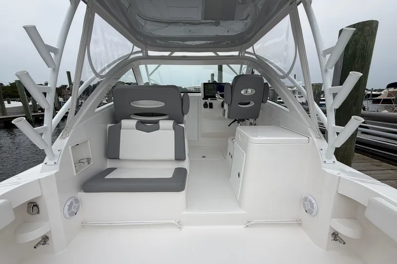 Slide: The Image of 2024 Albemarle 30 Express boat interior with seating and helm station. - 25