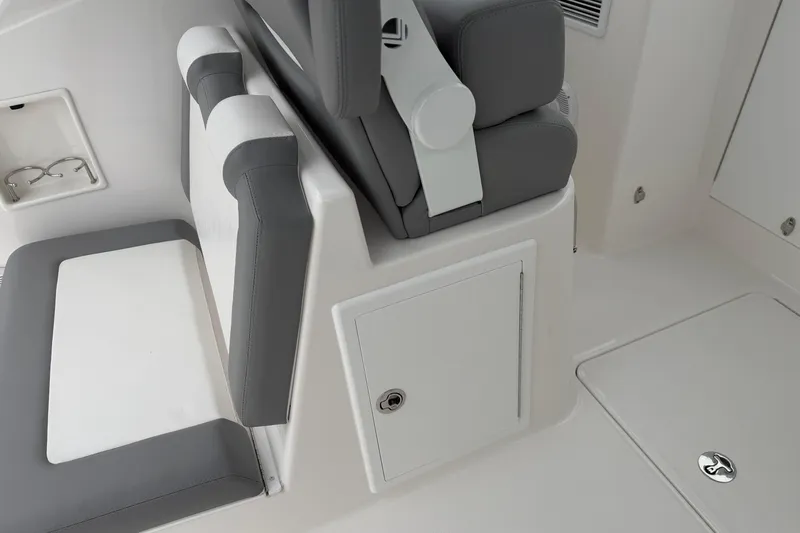Slide: The Image of 2024 Albemarle 30 Express boat interior with gray and white seating and storage compartments. - 32