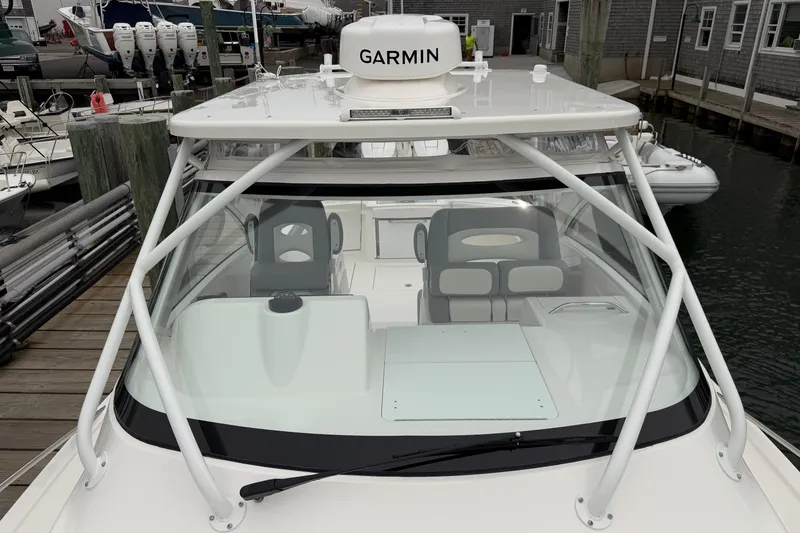 Slide: The Image of 2024 Albemarle 30 Express boat with Garmin equipment, docked at a marina. - 57