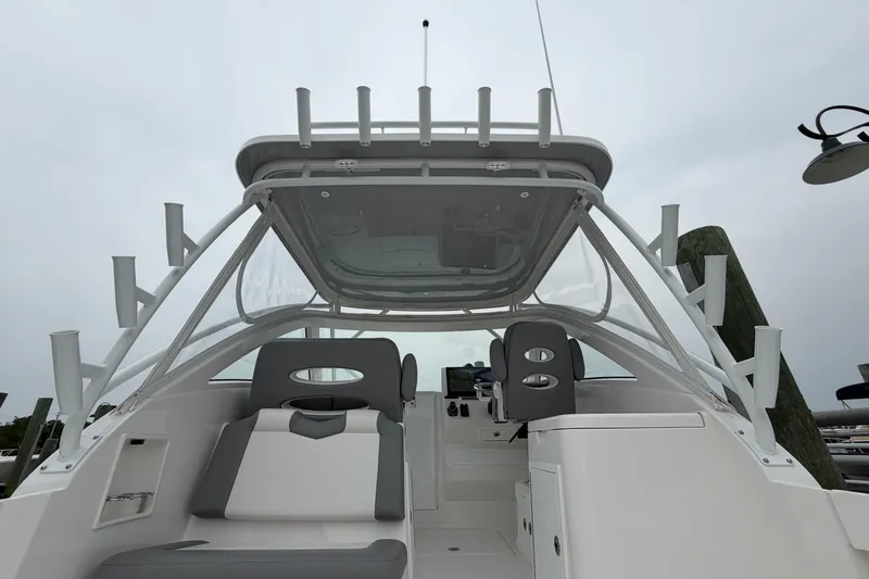 Slide: The Image of 2024 Albemarle 30 Express boat interior with seating and rod holders. - 24
