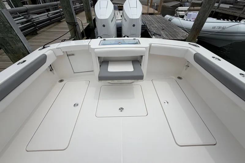 Slide: The Image of 2024 Albemarle 30 Express boat deck with seating and storage compartments. - 17
