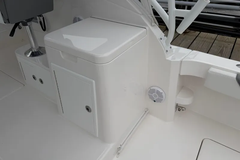 Slide: The Image of 2024 Albemarle 30 Express boat interior with storage compartment and seating. - 28