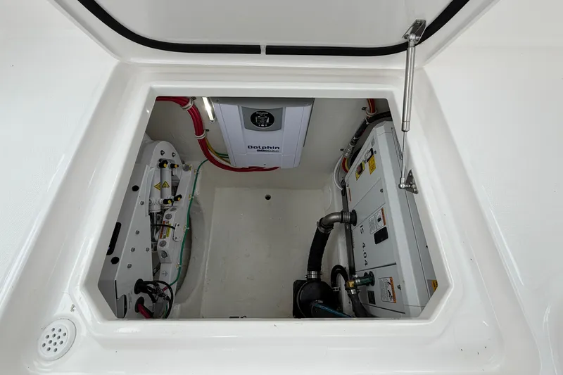 Slide: The Image of 2024 Albemarle 30 Express engine compartment with Dolphin charger and wiring. - 37