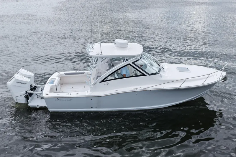 Slide: The Image of 2024 Albemarle 30 Express boat on water, featuring sleek design and powerful Mercury engines. - 11