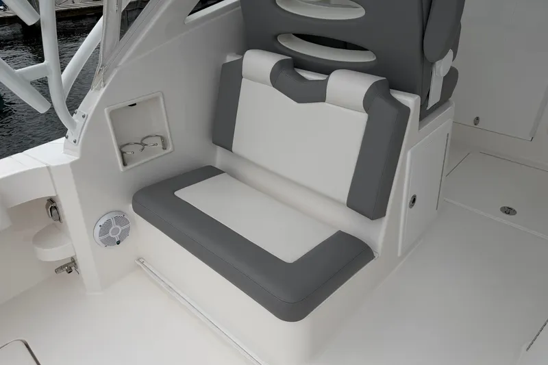 Slide: The Image of 2024 Albemarle 30 Express boat interior with cushioned seating and storage compartments. - 26