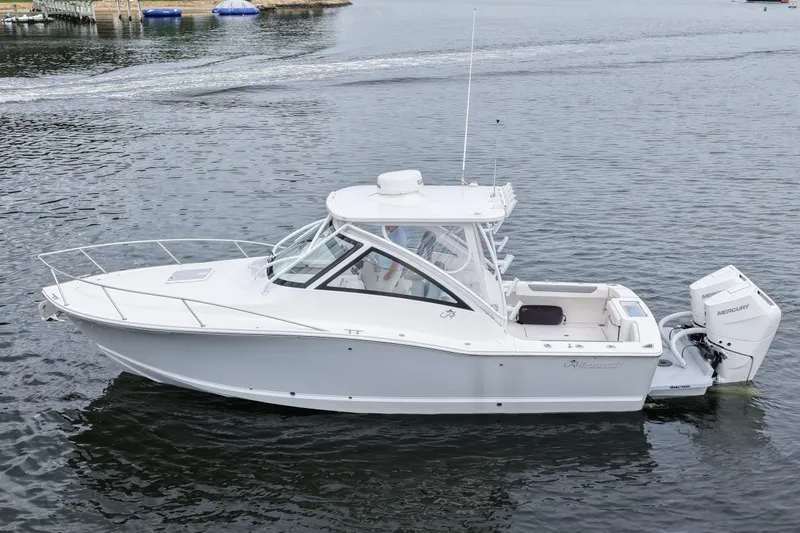 Slide: The Image of 2024 Albemarle 30 Express boat on calm water, side view. - 9