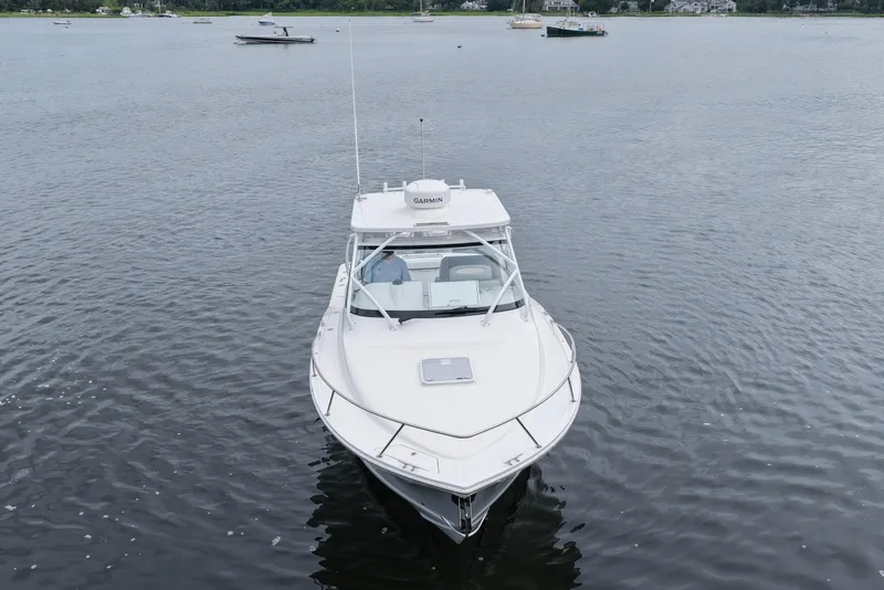 Slide: The Image of 2024 Albemarle 30 Express boat on calm water, front view. - 10