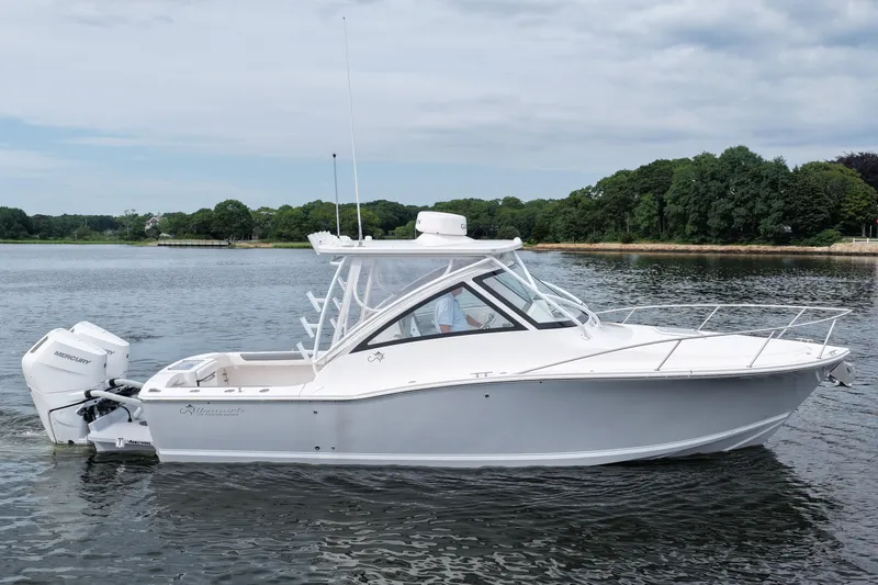 Slide: The Image of 2024 Albemarle 30 Express boat on calm water, featuring sleek design and powerful Mercury engines. - 5