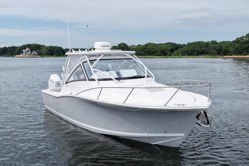Slide: The Image of 2024 Albemarle 30 Express boat on calm water, showcasing sleek design and modern features. - 3