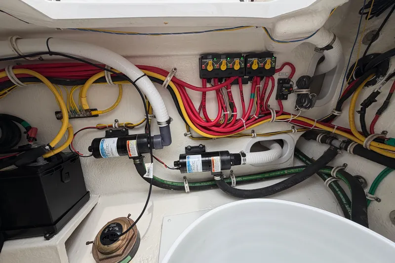 Slide: The Image of Electrical wiring and components inside a 2024 Albemarle 30 Express boat. - 21