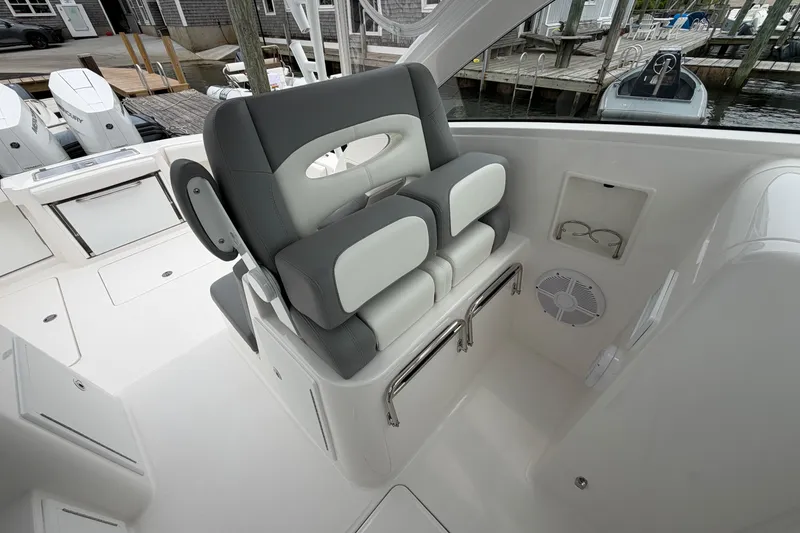 Slide: The Image of 2024 Albemarle 30 Express boat interior with cushioned seating and modern design. - 52