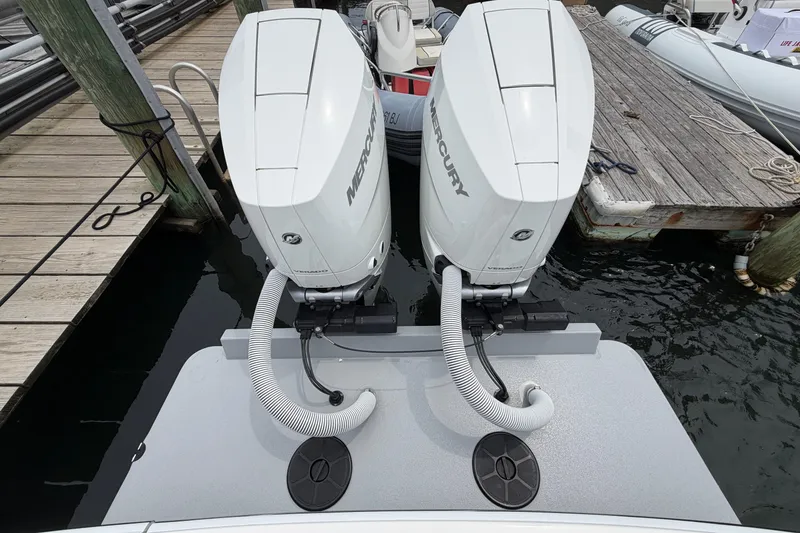 Slide: The Image of 2024 Albemarle 30 Express with dual Mercury outboard engines docked at marina. - 14