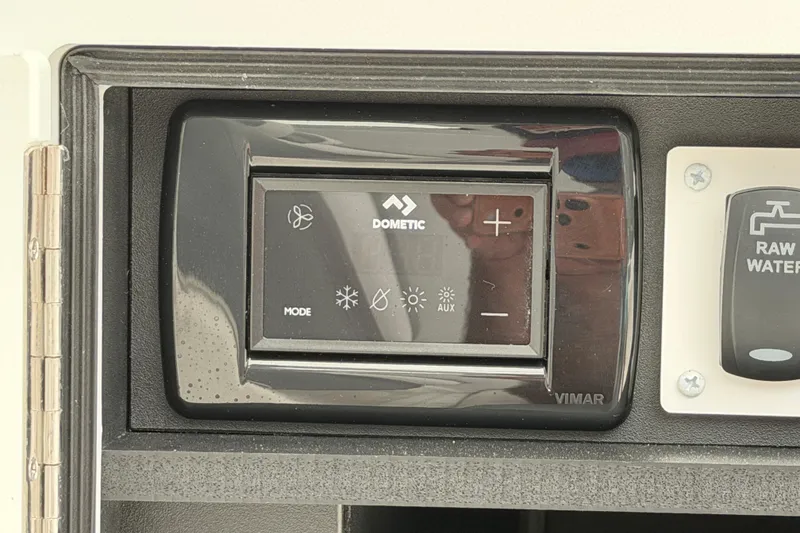 Slide: The Image of Control panel on 2024 Albemarle 30 Express boat featuring Dometic and raw water switches. - 31