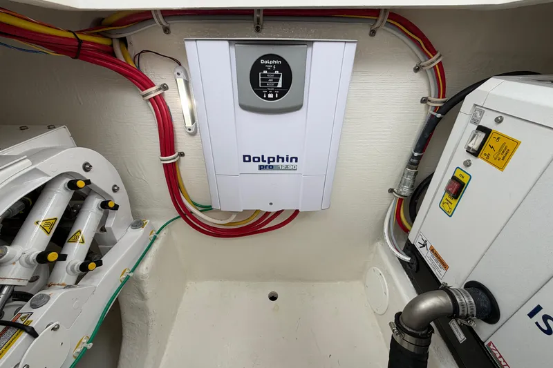 Slide: The Image of Electrical system inside 2024 Albemarle 30 Express boat, featuring Dolphin Pro charger. - 38