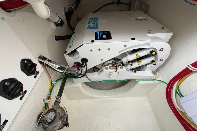 Slide: The Image of Engine compartment of 2024 Albemarle 30 Express boat, showcasing mechanical components and wiring. - 39