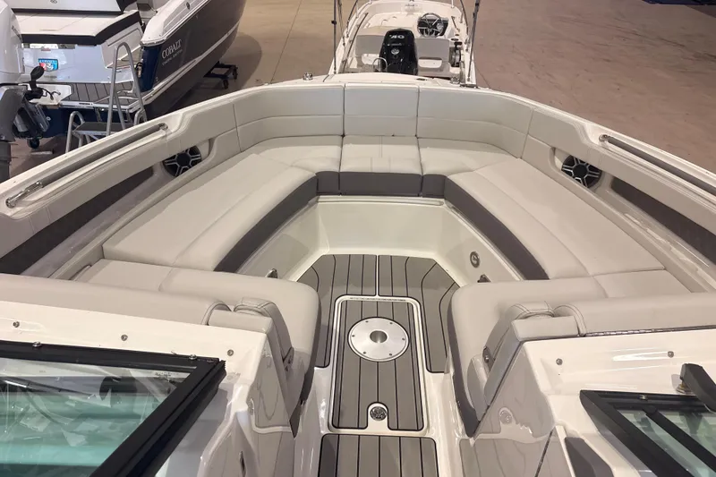 Slide: The Image of 2026 Sea Ray SLX 310 Outboard boat interior with spacious seating and sleek design. - 11