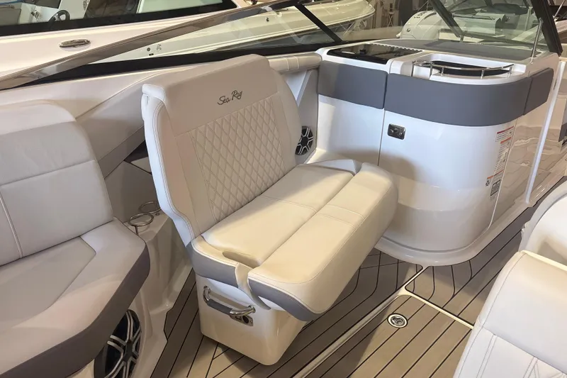 Slide: The Image of 2026 Sea Ray SLX 310 Outboard interior with luxurious seating and modern design. - 15