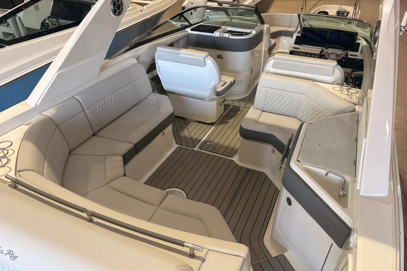 Slide: The Image of 2026 Sea Ray SLX 310 Outboard boat interior with luxurious seating and modern design. - 20