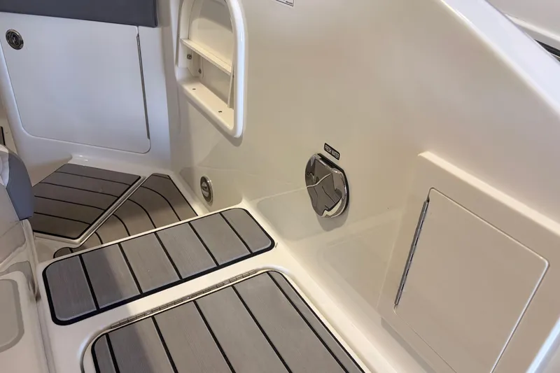 Slide: The Image of Interior view of 2026 Sea Ray SLX 310 Outboard boat, featuring sleek design and flooring. - 21