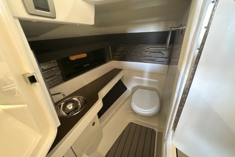 Slide: The Image of Luxurious bathroom interior of 2026 Sea Ray SLX 310 Outboard boat, featuring modern fixtures. - 26